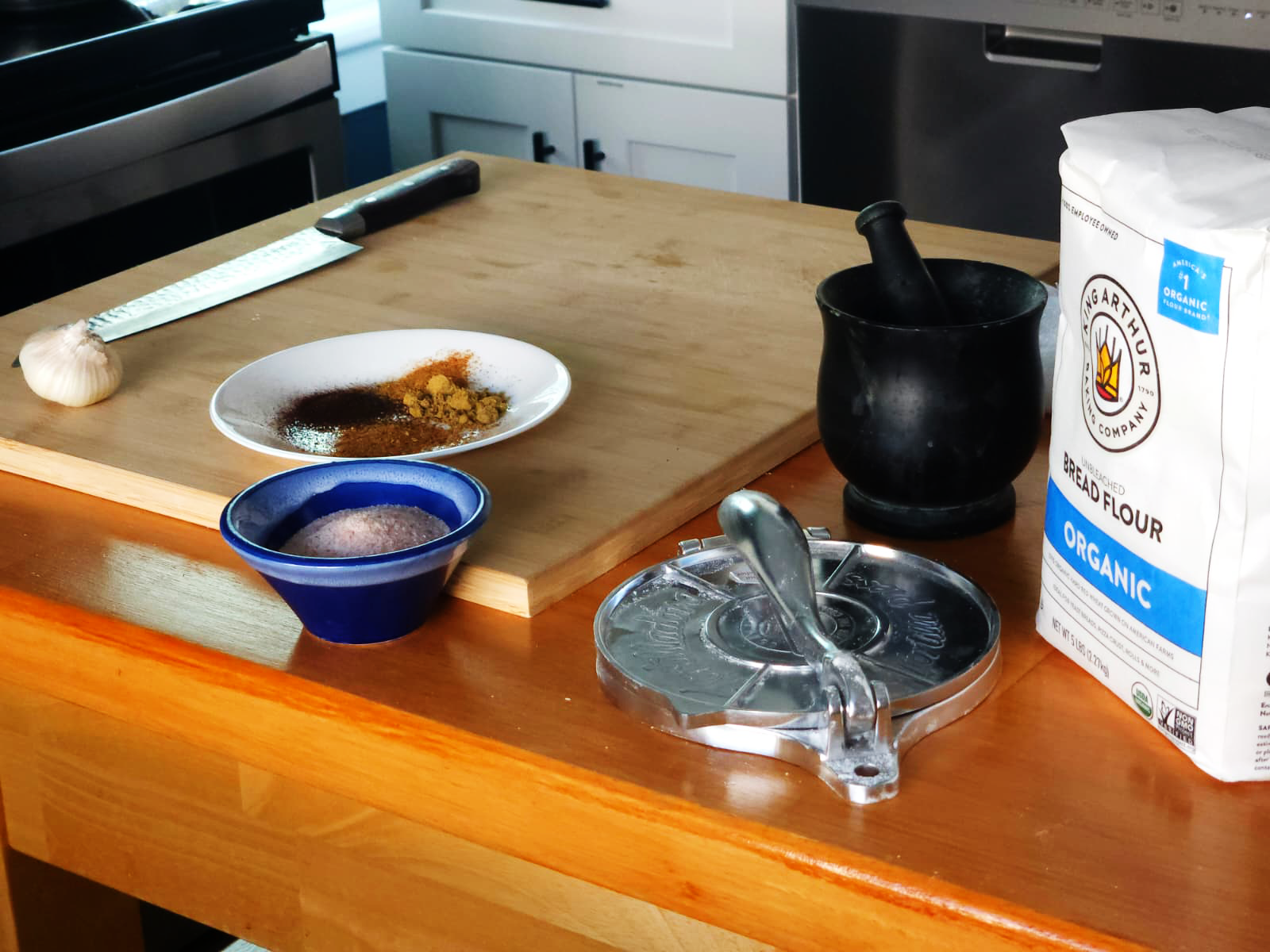 Organic ingredients and handmade cooking tools in Chef Troy's kitchen