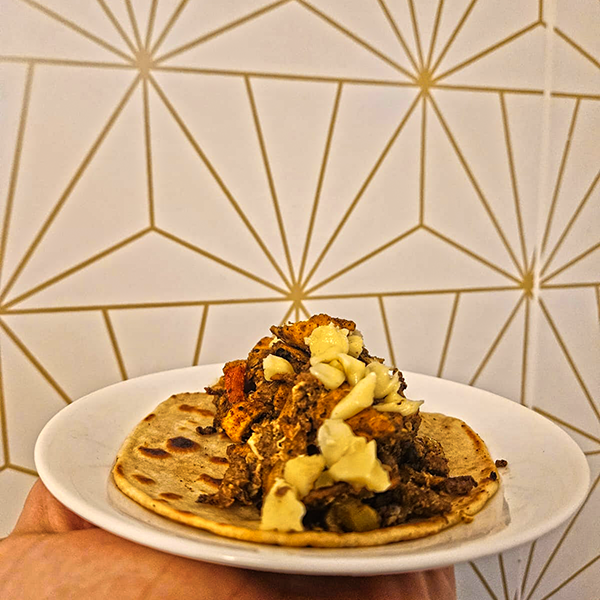 A loaded Chilaquiles Rebel taco