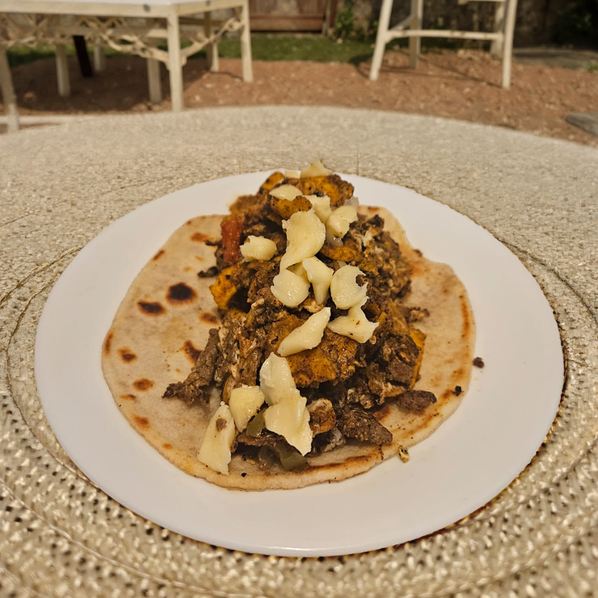 Step 4: tortilla loaded into a finished taco